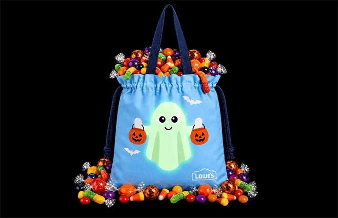 Lowe's exclusive free Trick or Treat tote bag displayed on a store shelf