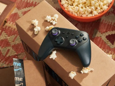 Amazon boxes, entertainment remote and popcorn illustrating Prime benefits