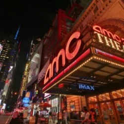 AMC Theatres marquee lit up at night, AMC movie ticket bundles on sale at Giftory