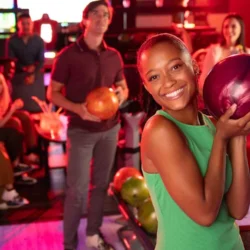 Family bowling together at Bowlero Family Fest